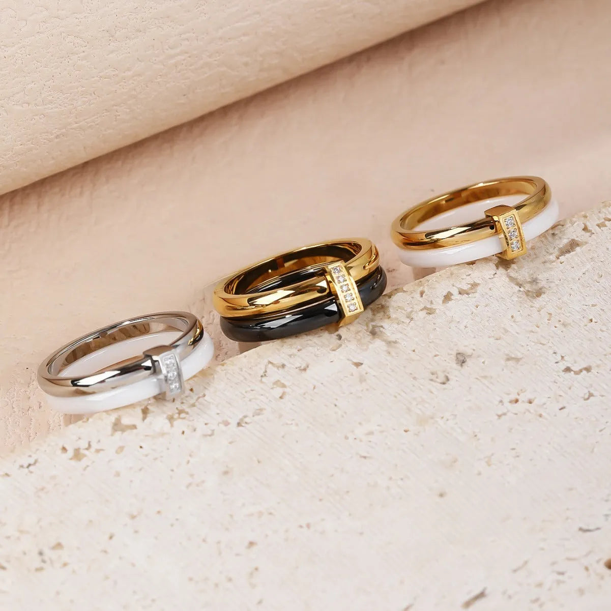 A glossy titanium steel women's double ring with a heart-shaped zirconium inlay, shown in steel white colour.