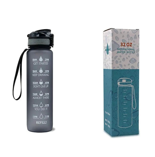 Blue and red gradient 1-litre Tritan sports water bottle with time markers, flip-top lid, and wrist strap.