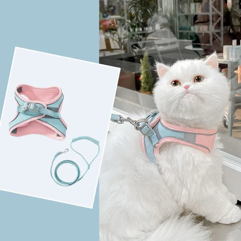 Blue and orange stitched suede cat vest harness with reflective chest strip and attached hand holding rope.