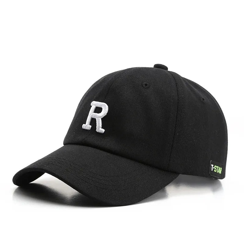 Adjustable cotton baseball cap with embroidered letter R in beige colour, dome style, unisex design
