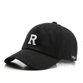 Adjustable cotton baseball cap with embroidered letter R in beige colour, dome style, unisex design