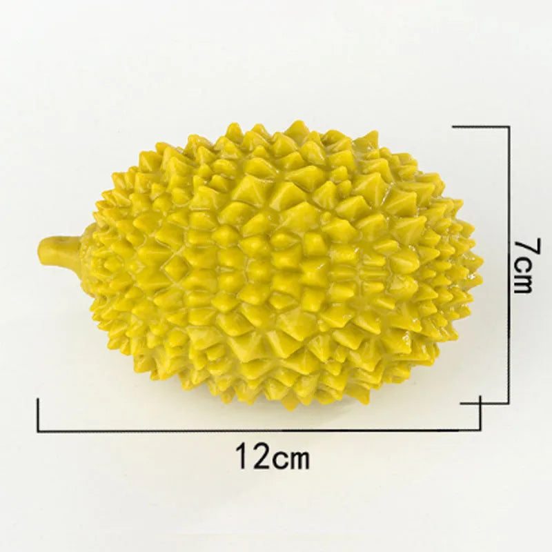 Colourful durian-shaped dog chew toy with textured surface and a squeaky ball