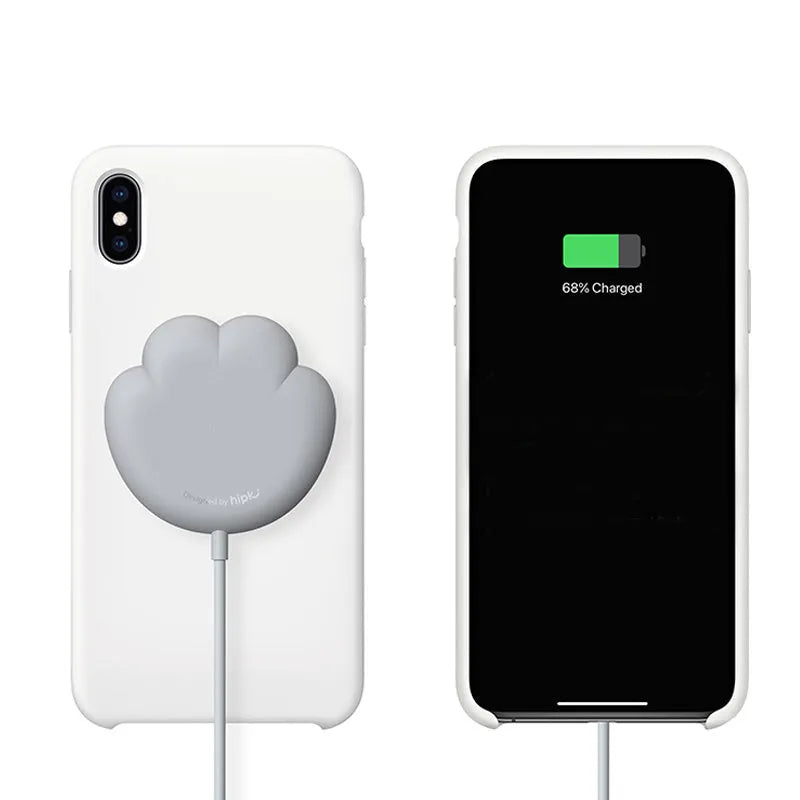 Pink cat claw sucker wireless charger with USB cable on a desk