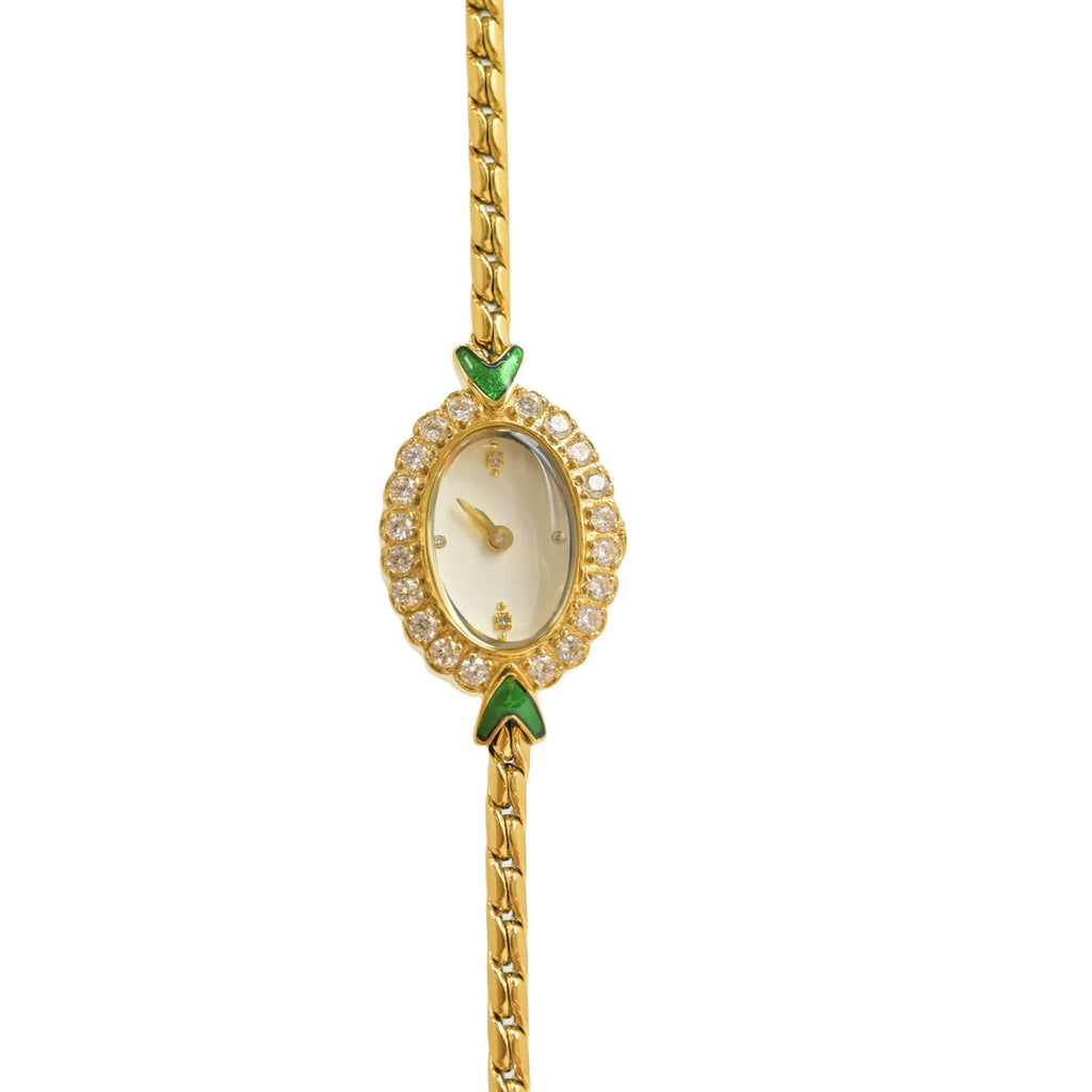 European small gold women's watch with handmade rhinestone inlay and adjustable strap on light background