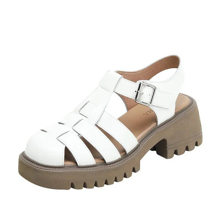Women's black retro platform sandals with chunky heel, hollow out design, and a buckle fastening.