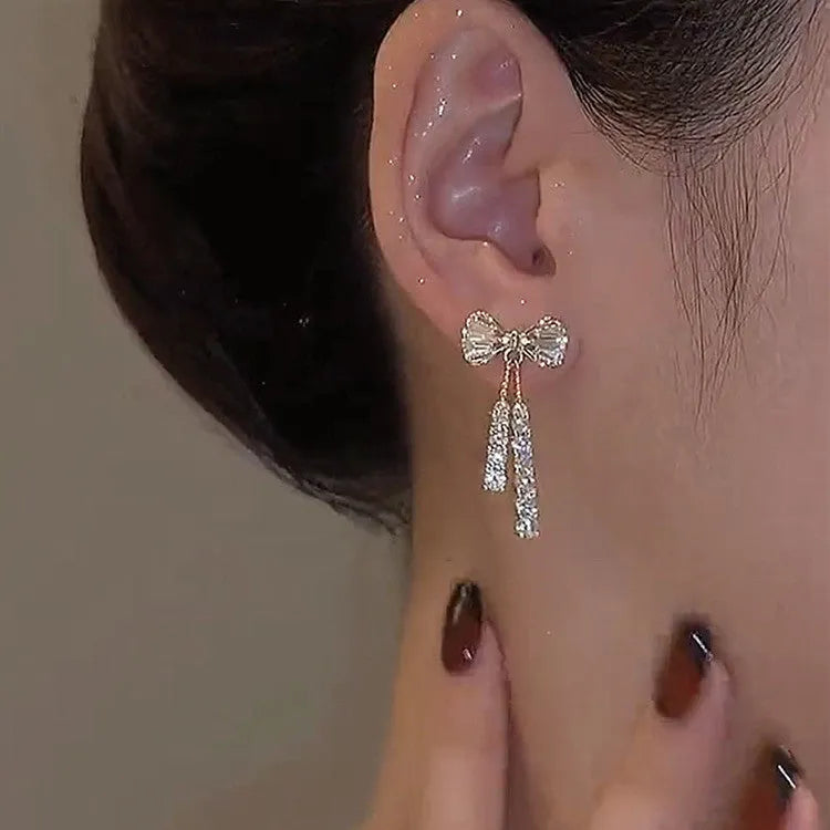 Gold alloy butterfly earrings with rhinestone accents and bow design for women