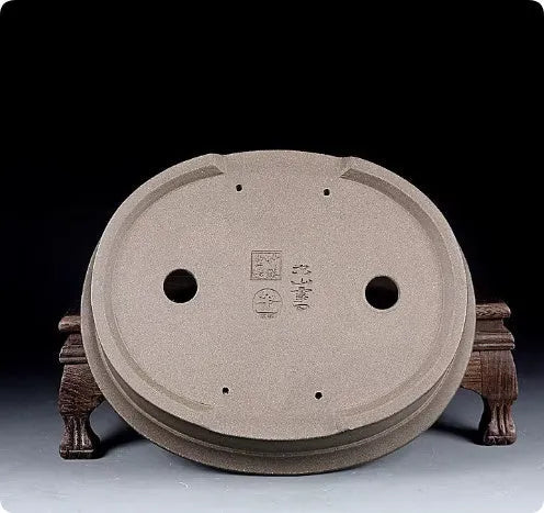 Handmade antique oval bonsai flower pot in purple sand ceramic, 25cm long by 21cm wide.