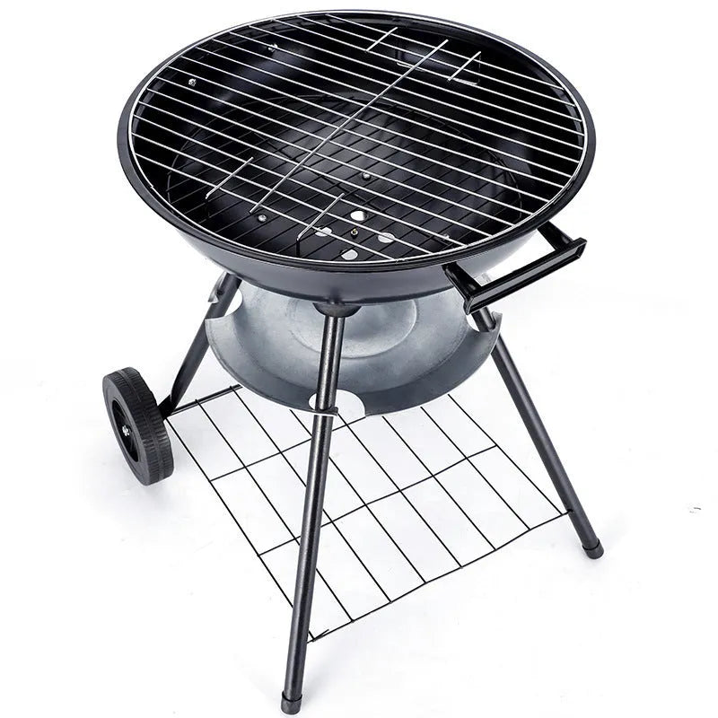A portable 14-inch diameter iron barbecue grill with an Apple Stove design, shown on a garden patio.