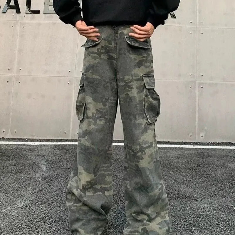 American Vintage cargo pants in washed camouflage colour with multiple pockets and a mid-waist fit.