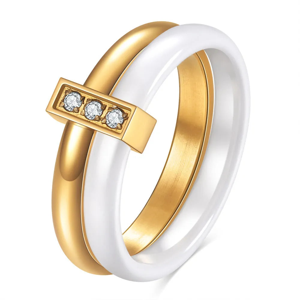 Glossy black ceramic women's ring with round inlaid detail on a 6mm wide geometric band.