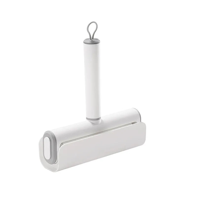 Handheld lint remover roller with tearable paper stick for removing pet hair from floors and furniture