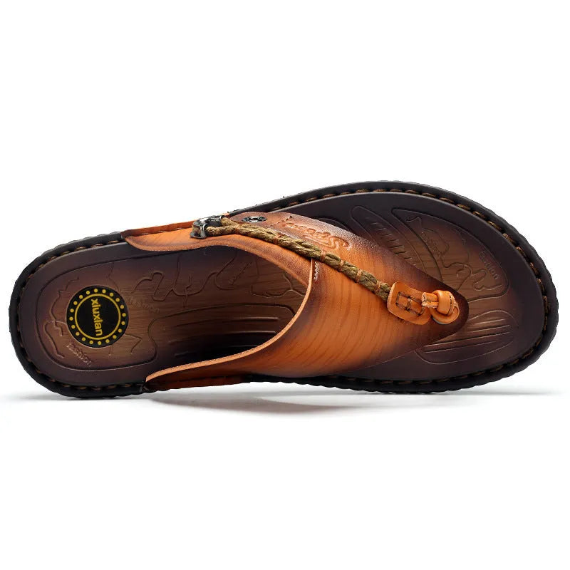 Men's dark blue herringbone pattern outdoor slippers with a rubber sole and leather lining.