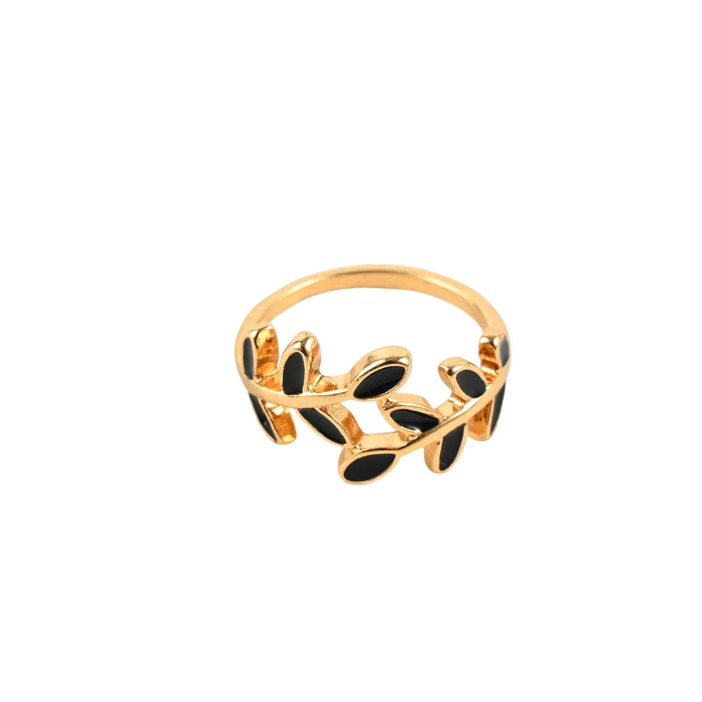 Geometric leaf ring with gold electroplated finish and simple floral design on finger
