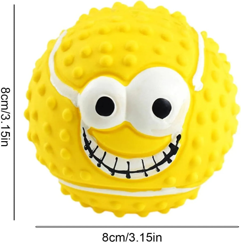 Green latex dog ball with a smiley face and squeaker for fetch games.
