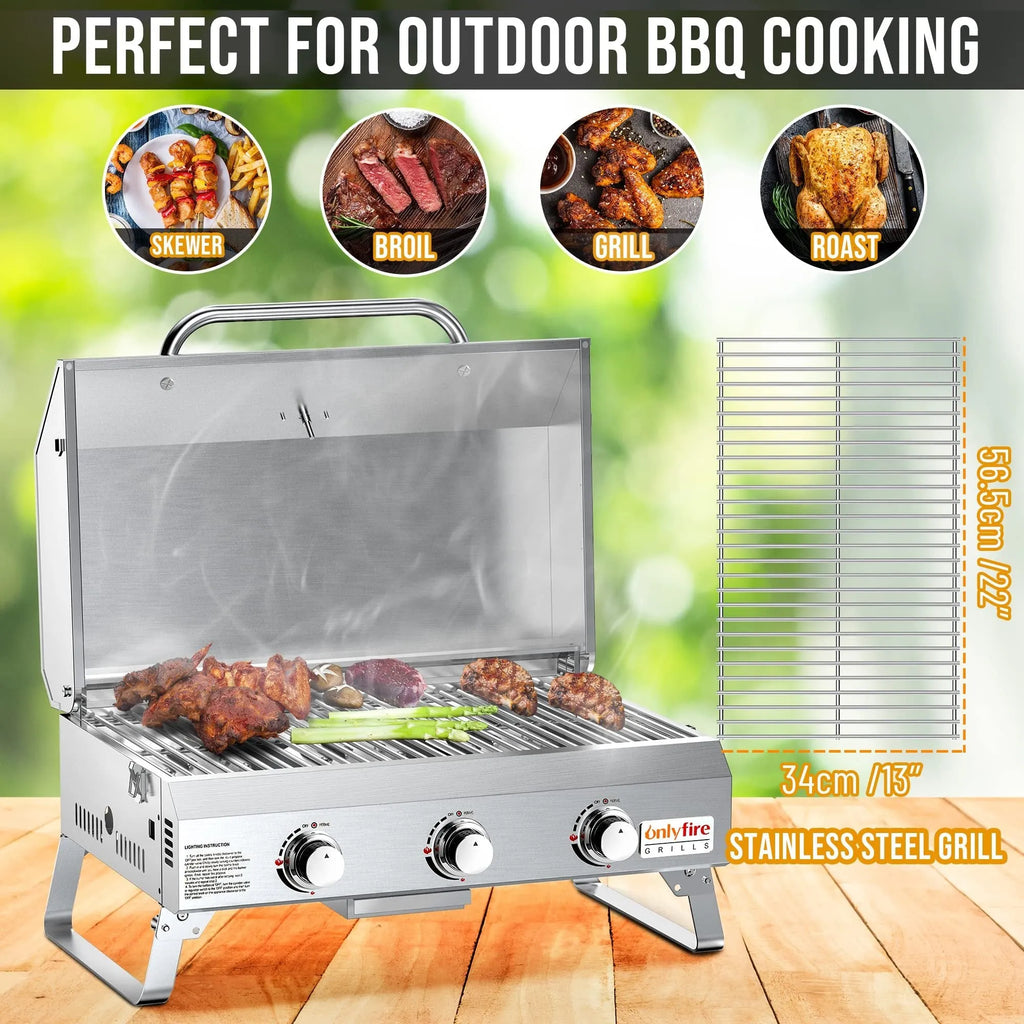 Silver desktop gas barbecue grill with three burners and foldable legs.