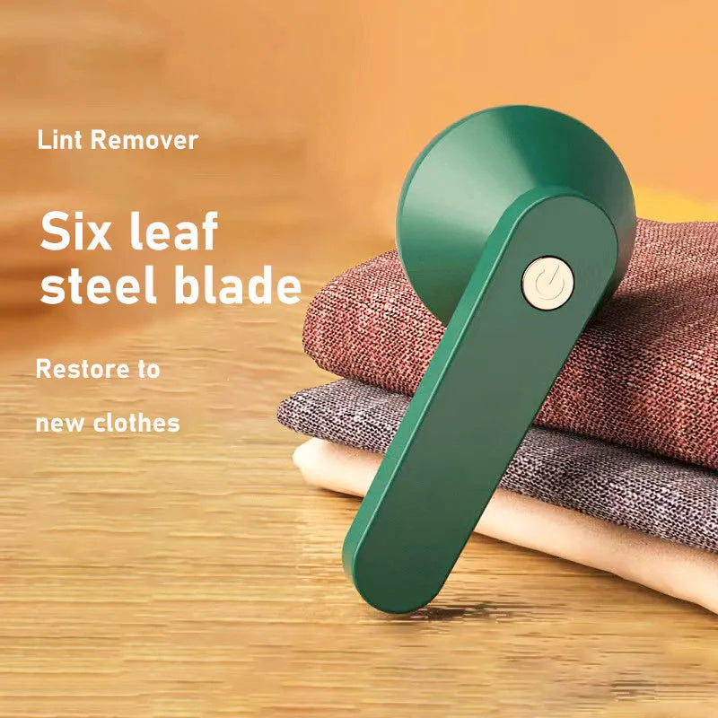 Green and white USB rechargeable electric lint remover with removable lint collector container.
