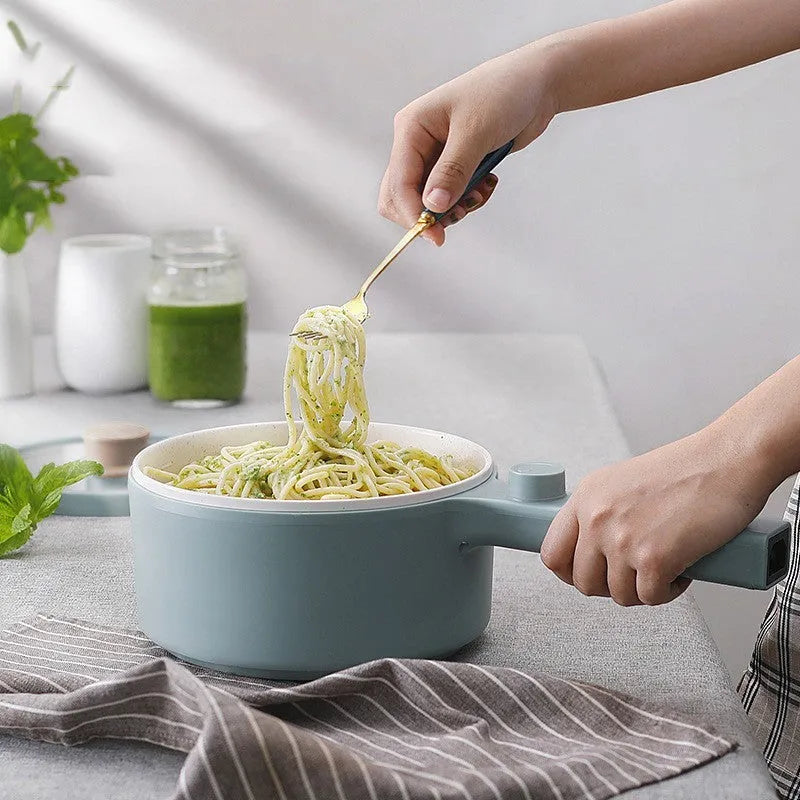 White and green portable electric cooking pot with multi-function controls and international plug