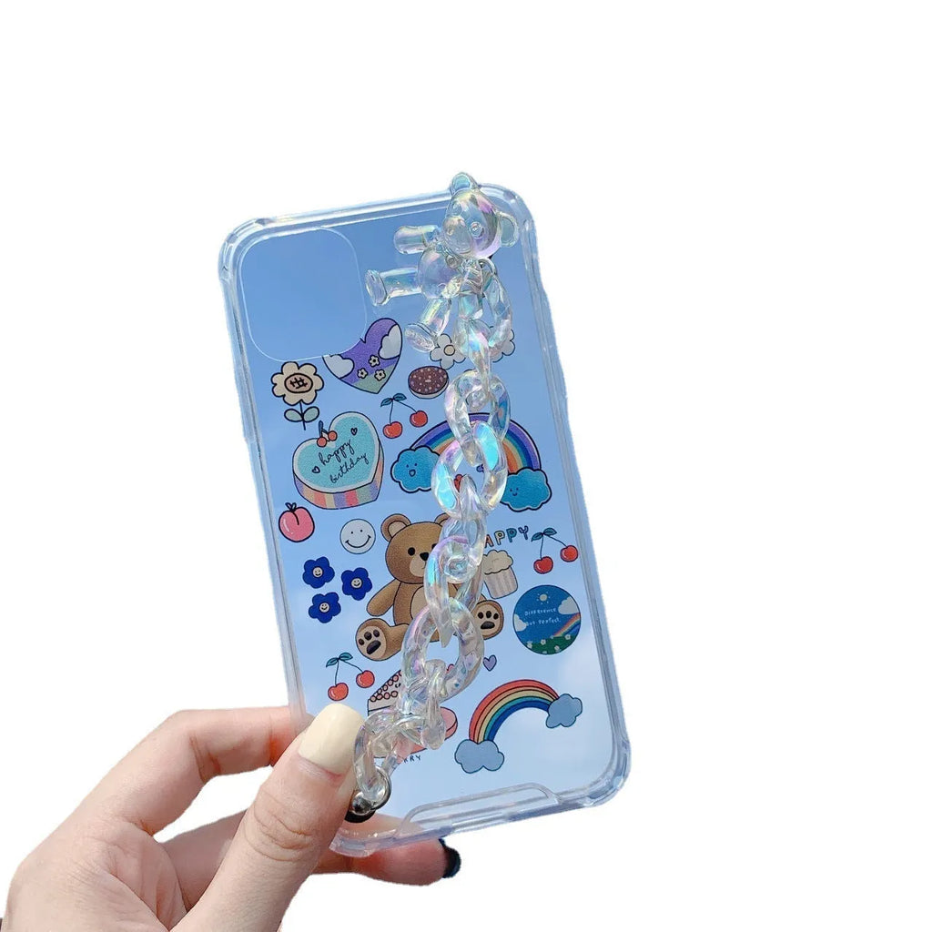 White TPU iPhone case with an attached silver bear pendant on a chain, showing cartoon-style design.