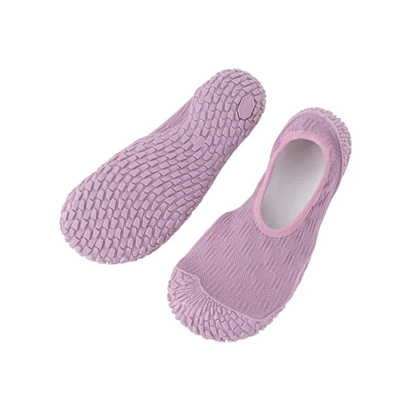 Women's low-top indoor fitness shoe in beige with a soft rubber sole and mesh lining.