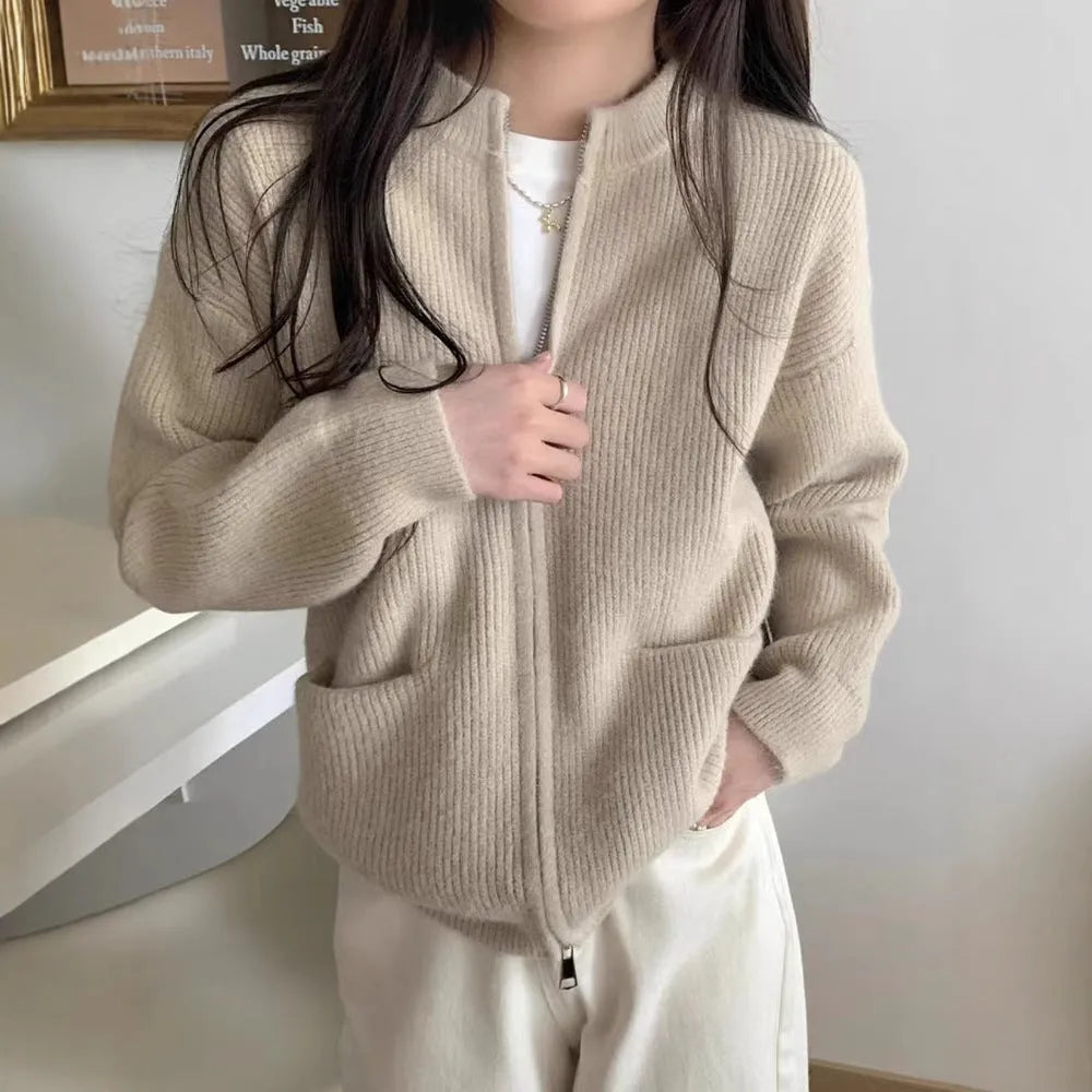 Soft beige viscose fibre sweater coat, a long-sleeve cardigan laid flat.