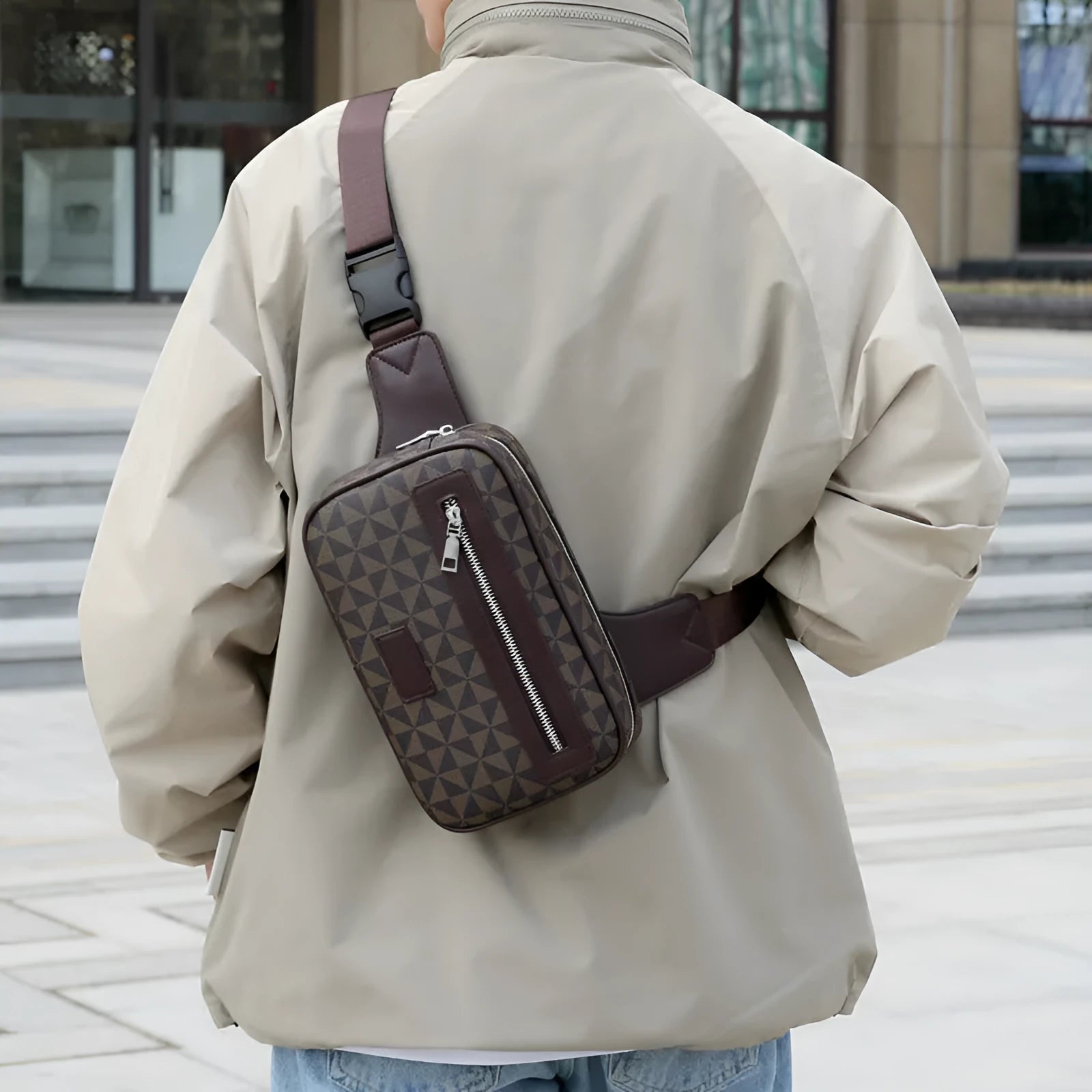 Men's black PU crossbody shoulder bag with chest-printed design and visible sewing lines