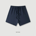 Men's cotton loose fit solid colour shorts in assorted colours like black, navy, and grey