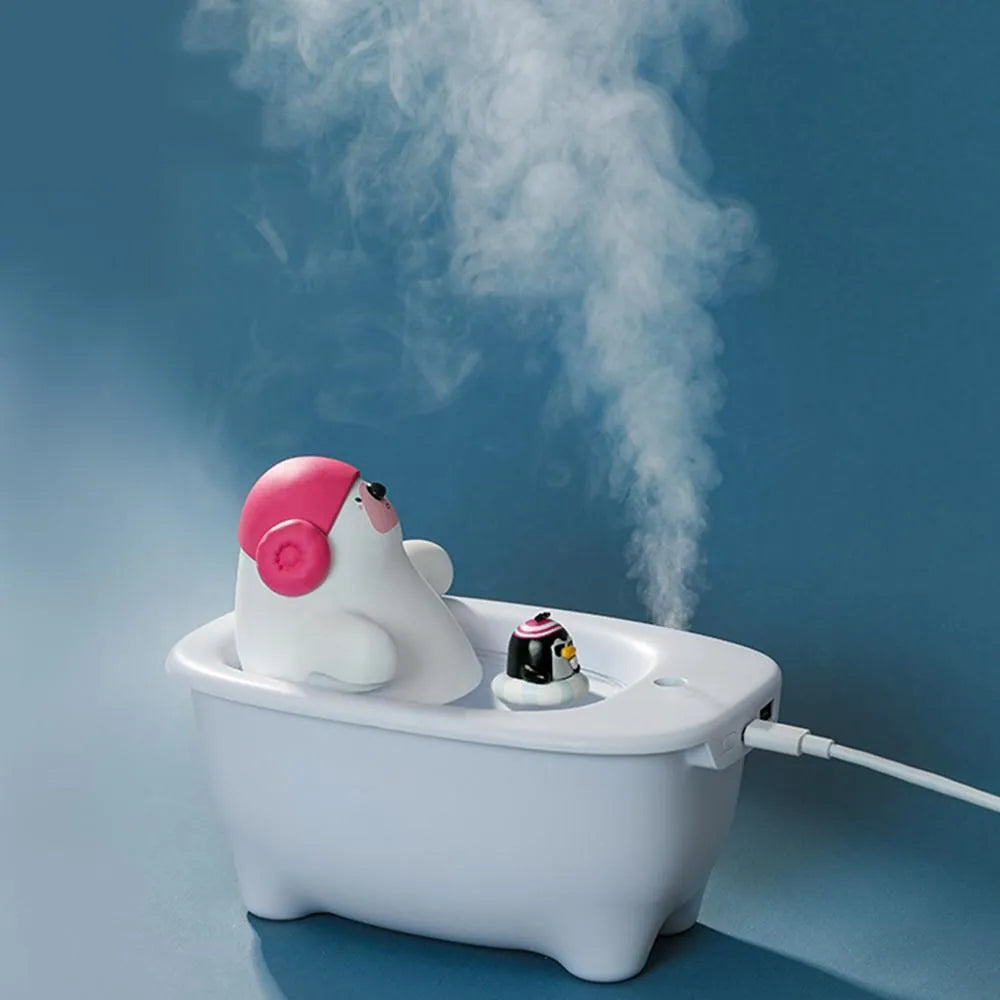 White USB-powered desktop air humidifier with large water tank on a desk.