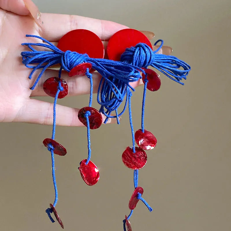 Women's handmade geometric drop earrings with blue resin flower in silver needle colour