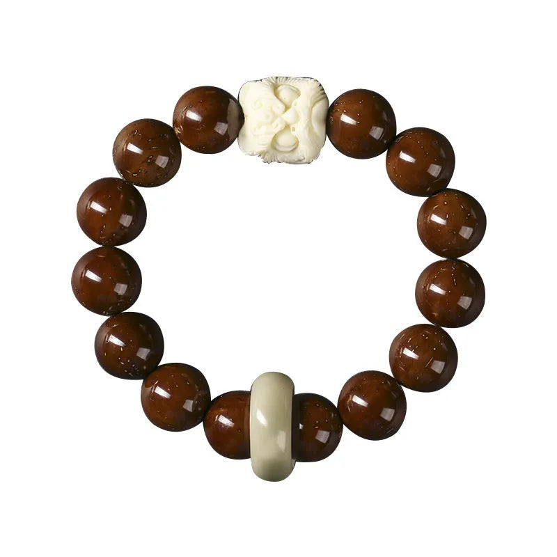 Hand-woven 13mm round bead bracelet with artistic lion designs in ivory nut, sandalwood or yellow gradient bodhi colours