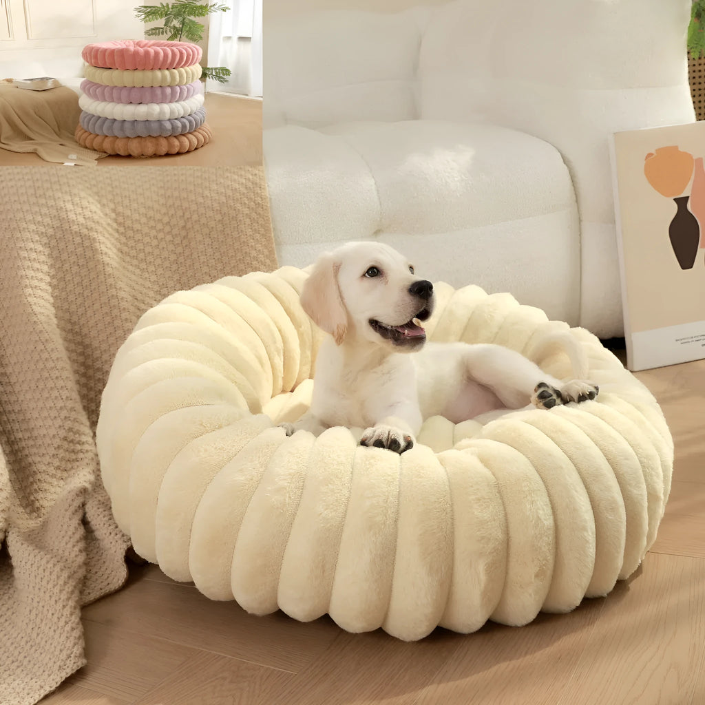 Round plush pet bed with long-hair rabbit fur style texture in beige colour