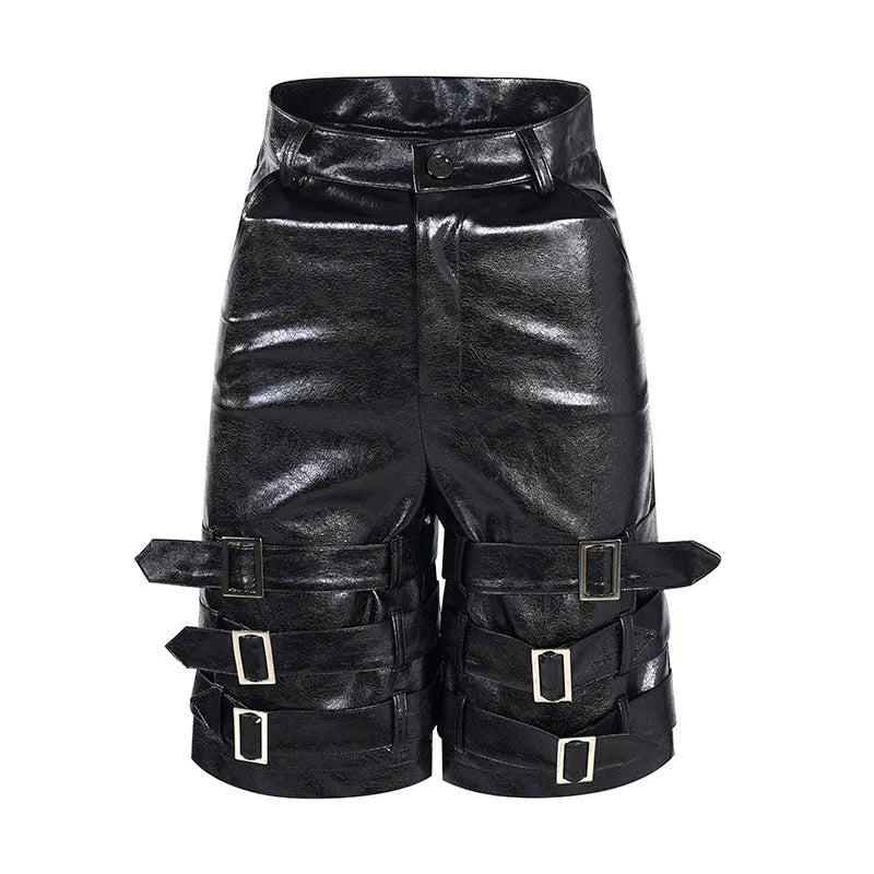 Man wearing black cropped PU leather shorts with a distinctive ring detail on the leg.