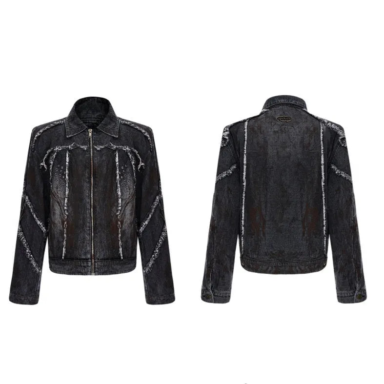 Black raw-edge splash-dye distressed denim coat with padded shoulders and matching trousers on a hanger.