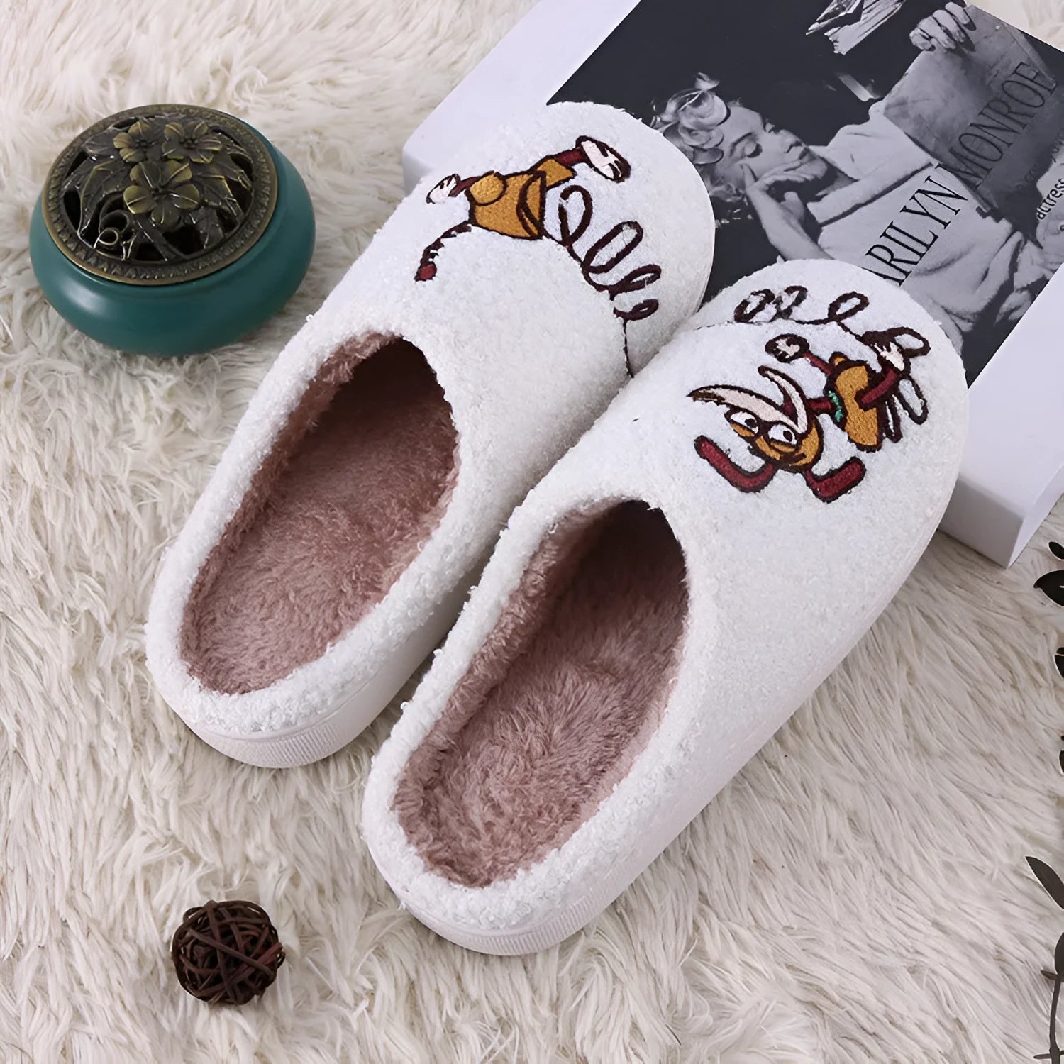White fluffy slippers with cartoon pattern, rubber soles, and artificial wool lining