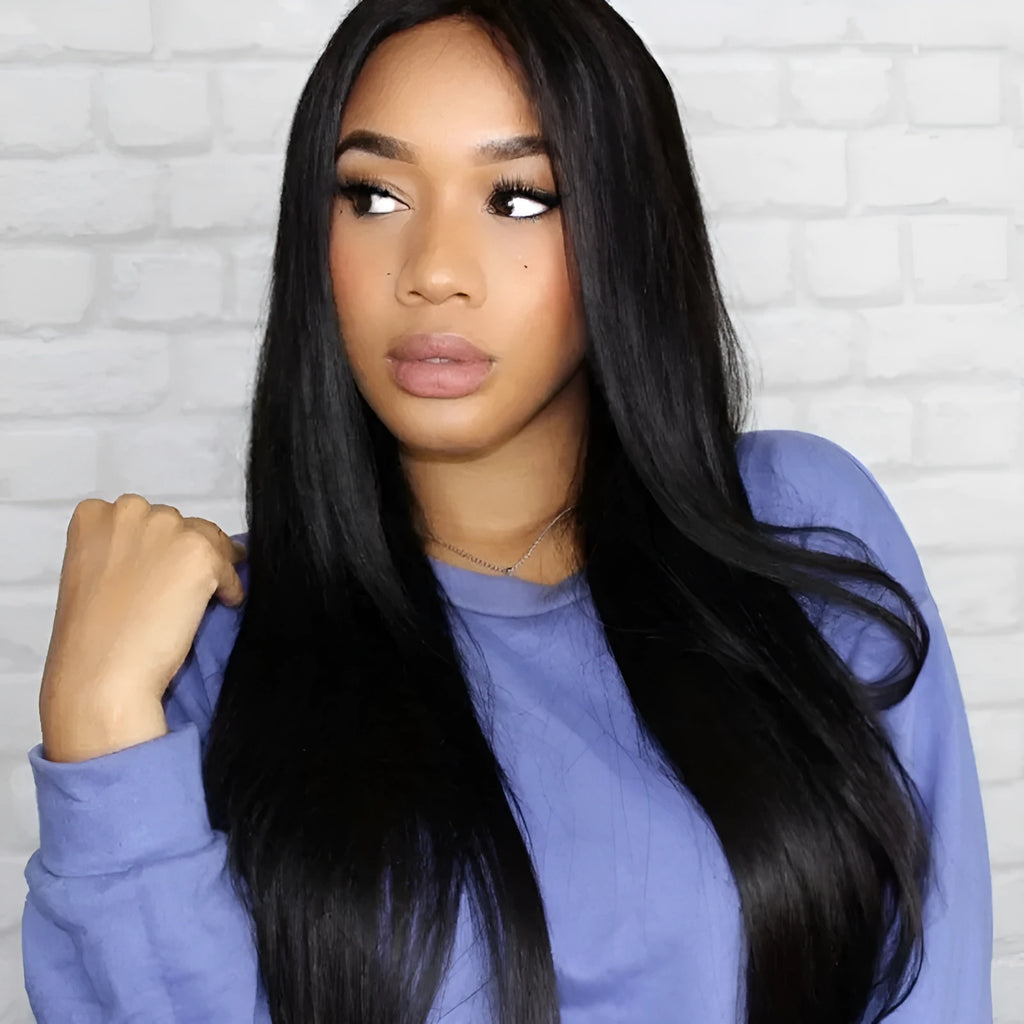 Long straight black synthetic wig with centre-parted fringe on a model