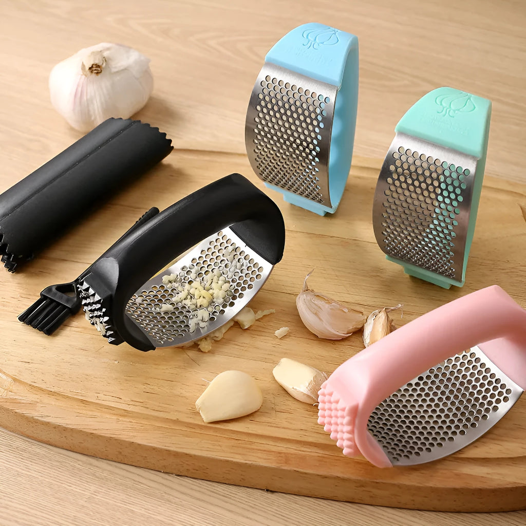 304 stainless steel garlic press with PP handles in four colour options measuring 11 by 7 centimetres