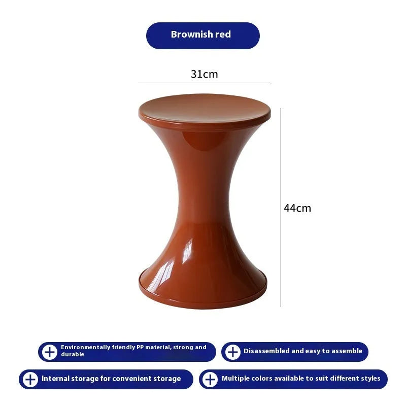 A plastic hourglass-style shoe changing stool, shown in one of the available colours.