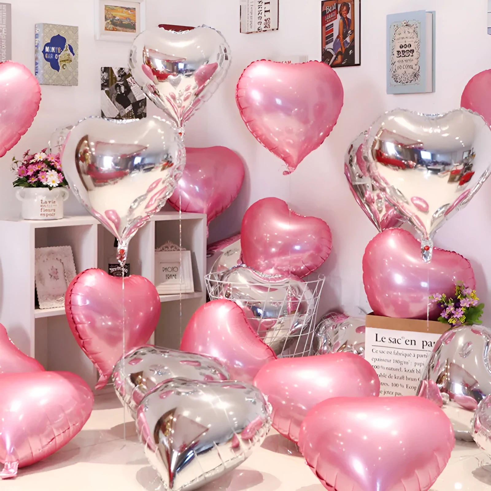 A pack of five shiny, silver, peach heart-shaped aluminium foil balloons on a plain background.