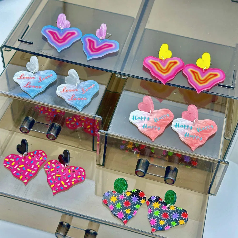 Color printing love heart acrylic earrings in six sweet styles A-F on white background