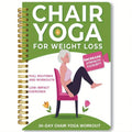 Green coil-bound 30-day chair yoga training notebook open to daily plan page