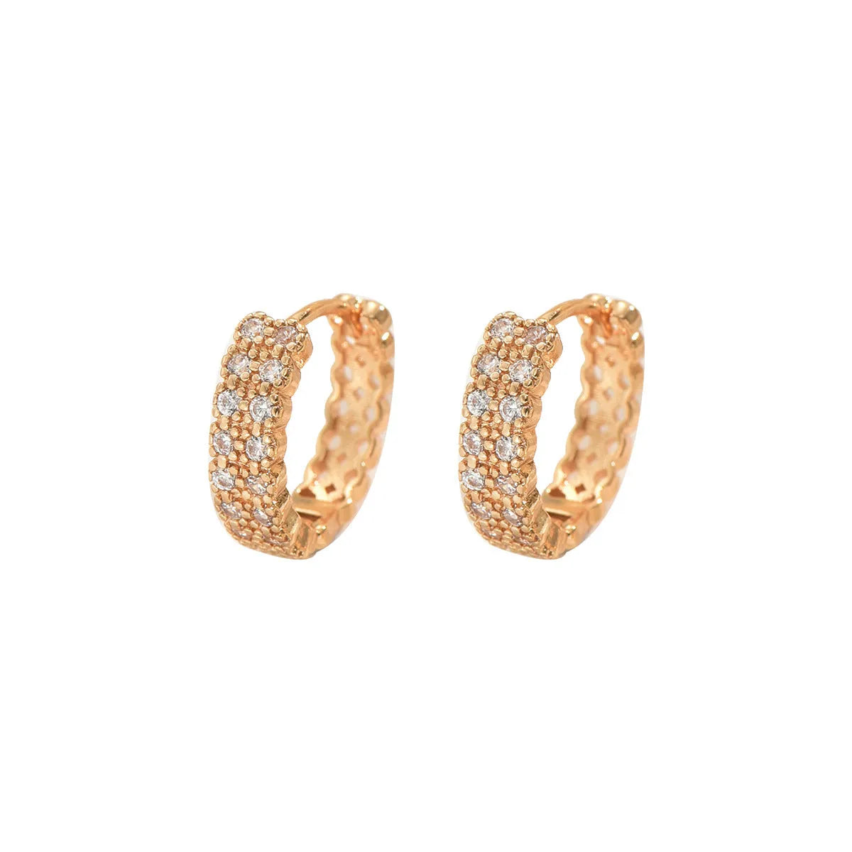 Copper geometry pattern stud earrings with round, dot, and ring details on a white background.