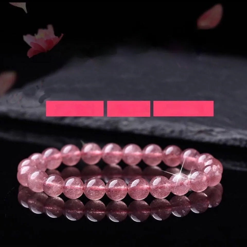 Polished strawberry quartz crystal bracelet for women, shown in three bead size options: 6mm, 8mm, and 10mm.
