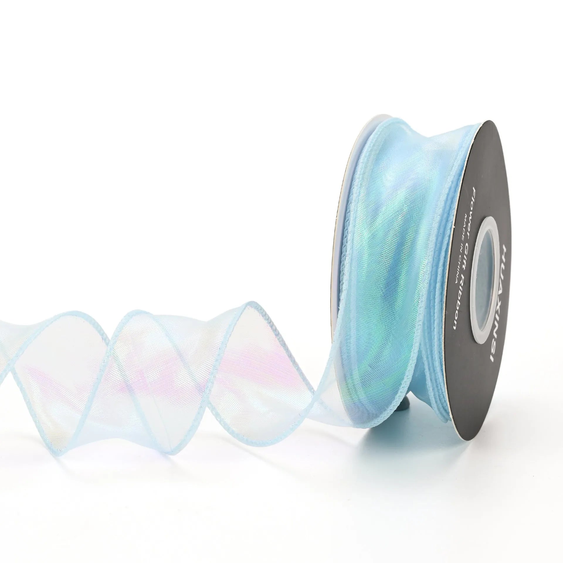 Roll of colourful fishtail yarn mesh ribbon showing its textured, wavy edge, with a colour selection including pink, yellow, and blue.