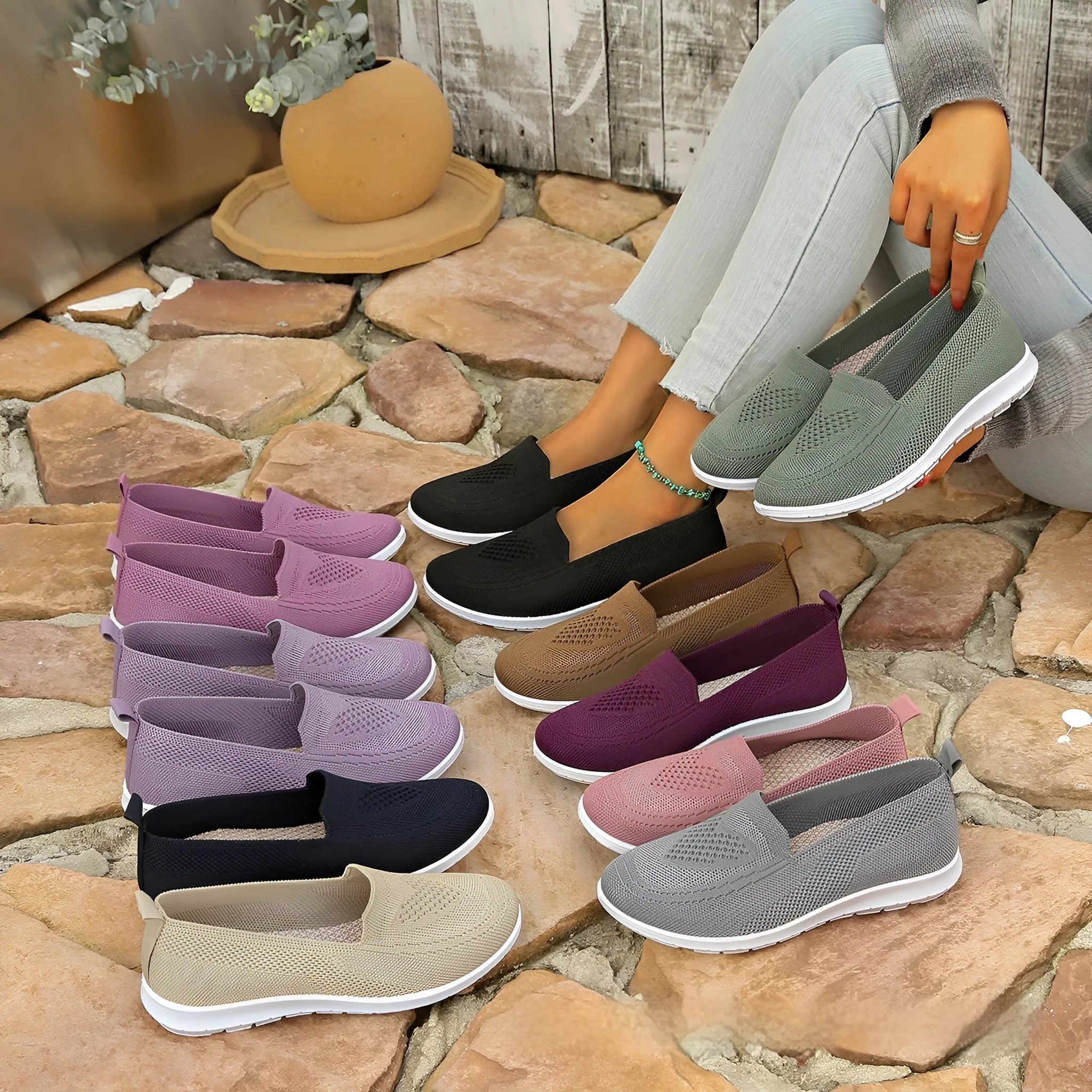 Women's beige canvas flat shoes with a heart pattern, mesh lining, and a flat rubber sole.