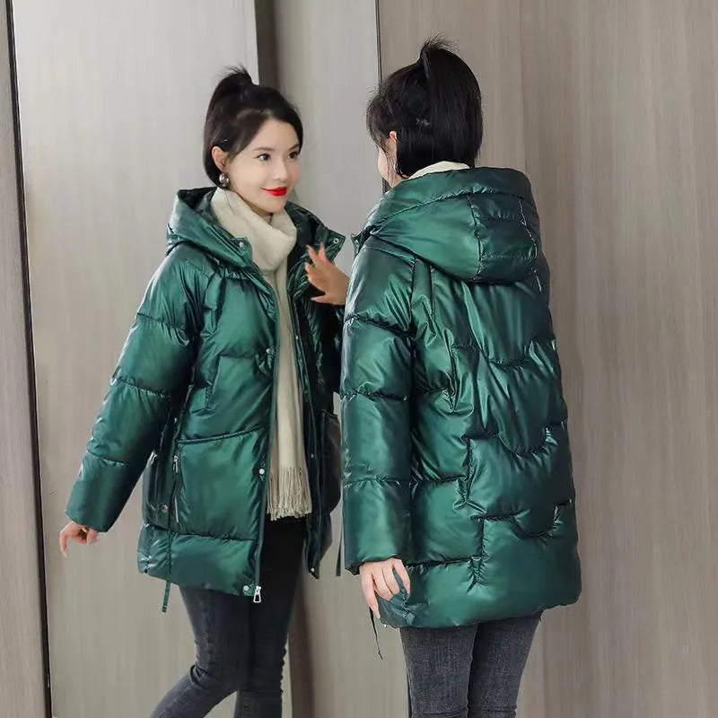 A woman's loose-fit hooded winter jacket in a poly-cotton blend, shown in a choice of colours including black and champagne.