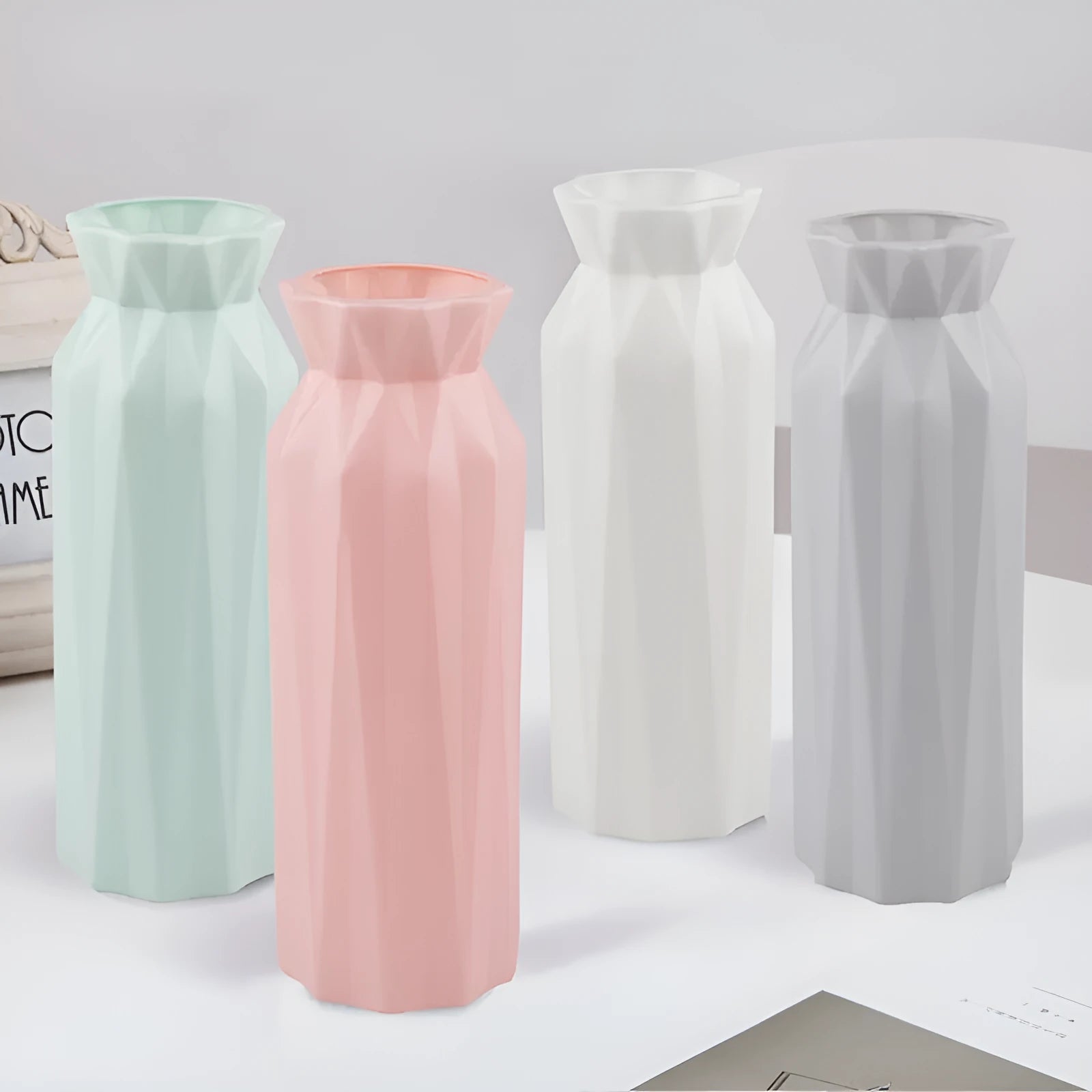Drop-resistant melamine plastic vase in green, grey, pink, or white colours.