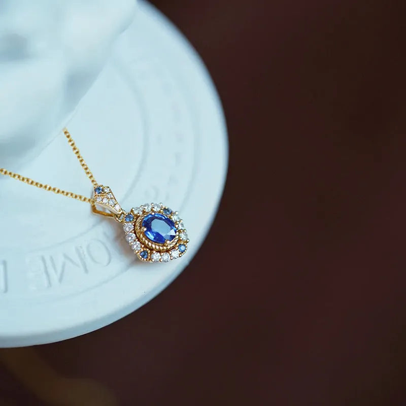 Huitan women's adjustable gold necklace with mixed gem and zircon pendant on a box chain, shown at various lengths.