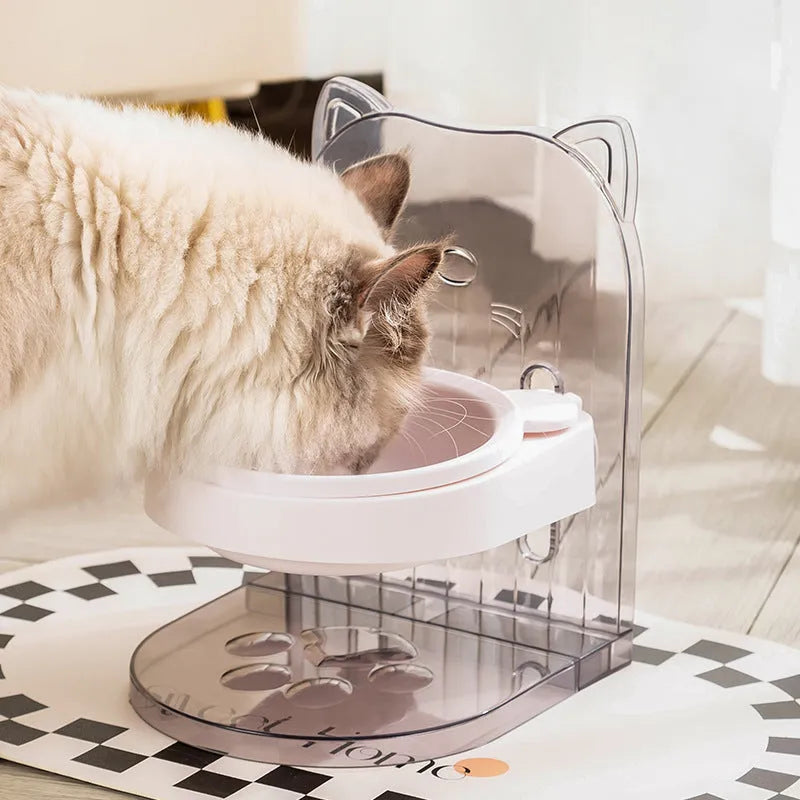 Grey adjustable height cat feeding bowl with anti-spill neck protection hanging on cage bars.