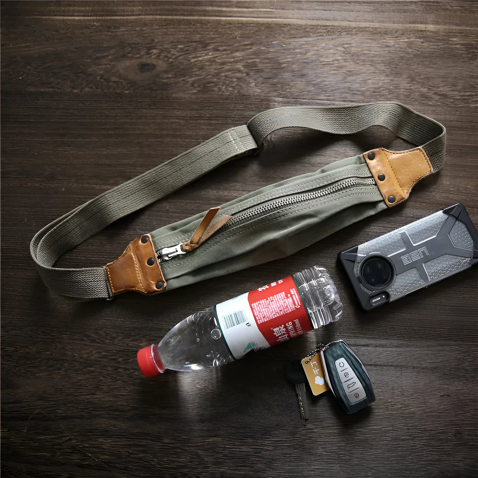 Green American retro military style chest bag with washed canvas and cowhide leather details
