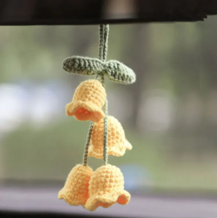 Green and white knitted wool car plant decoration with basin base and hanging rope