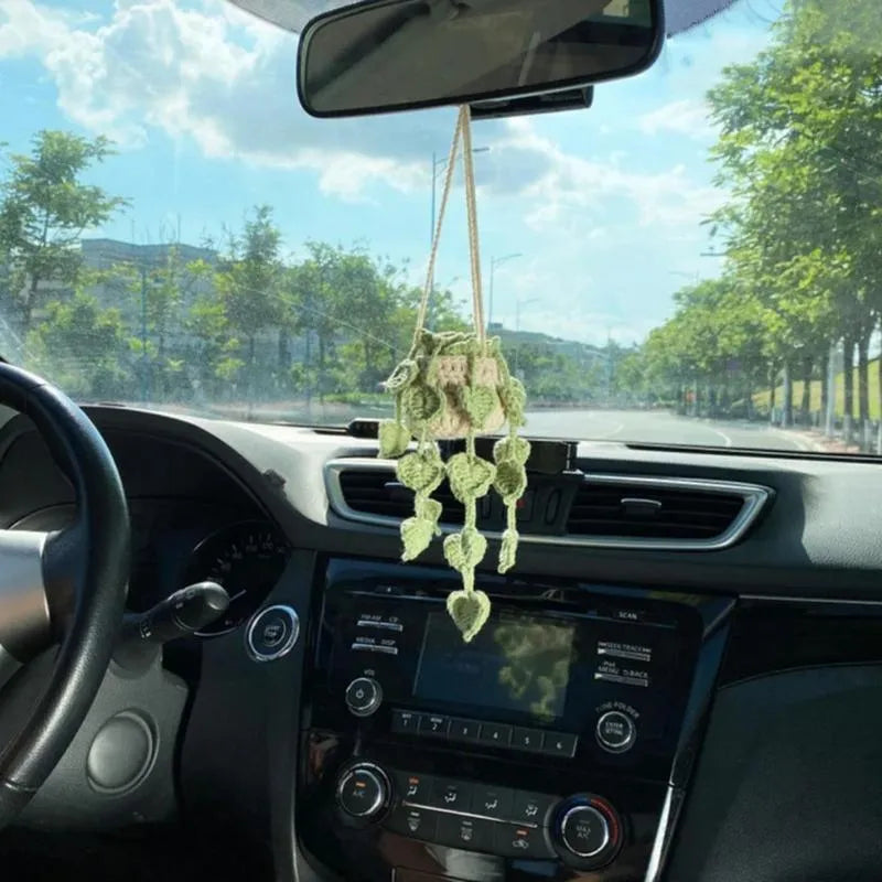 Green and white knitted wool car plant decoration with basin base and hanging rope